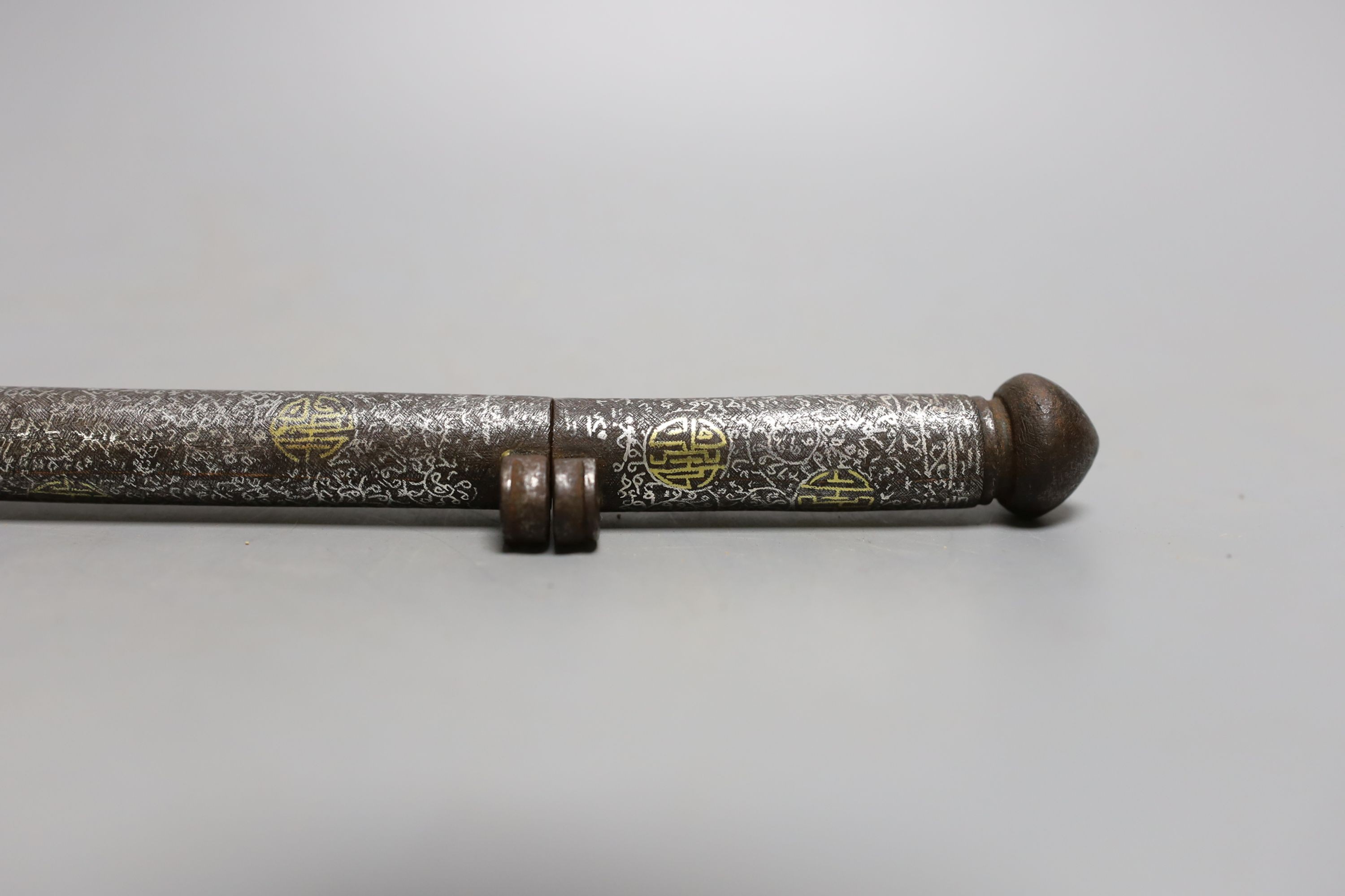 An 18th century Tibetan silver and gold damascened iron pen case, 31.5 cms long.